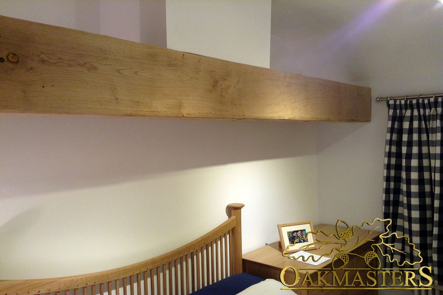 Oak beam casing for a load-bearing lintel above a bed