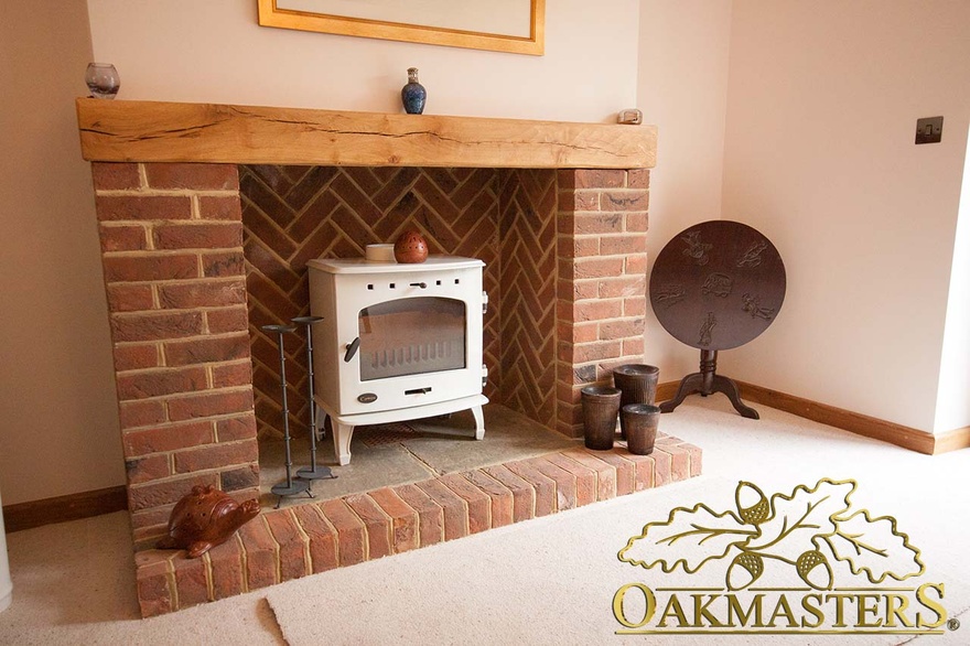 Modern brick fireplace with oak mantle beam