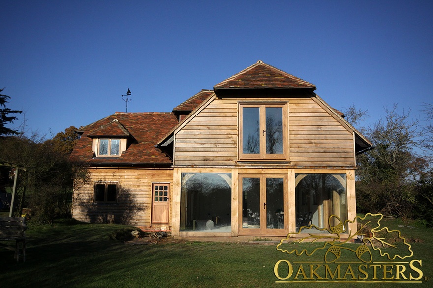 Glazed oak farmed house with integrated garage