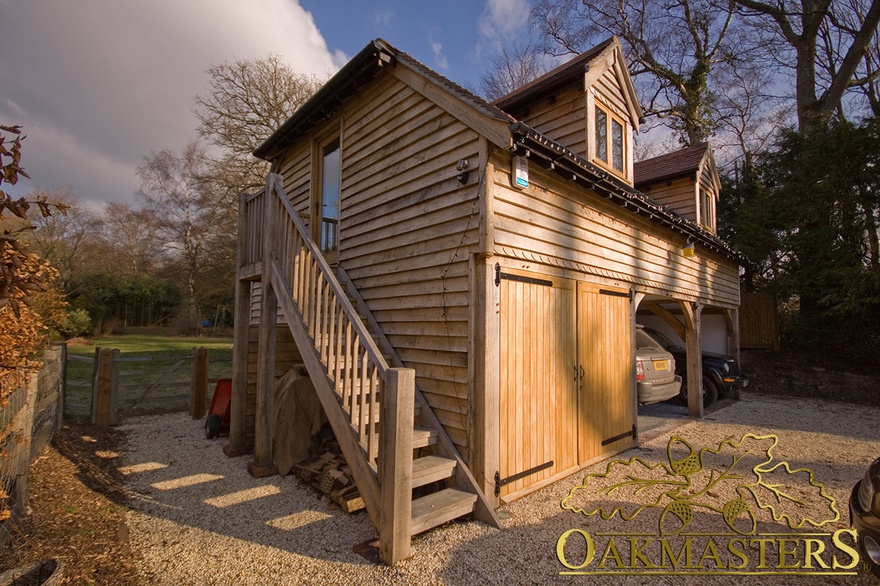 Access to the office above the oak framed garage is through an external oak staircase