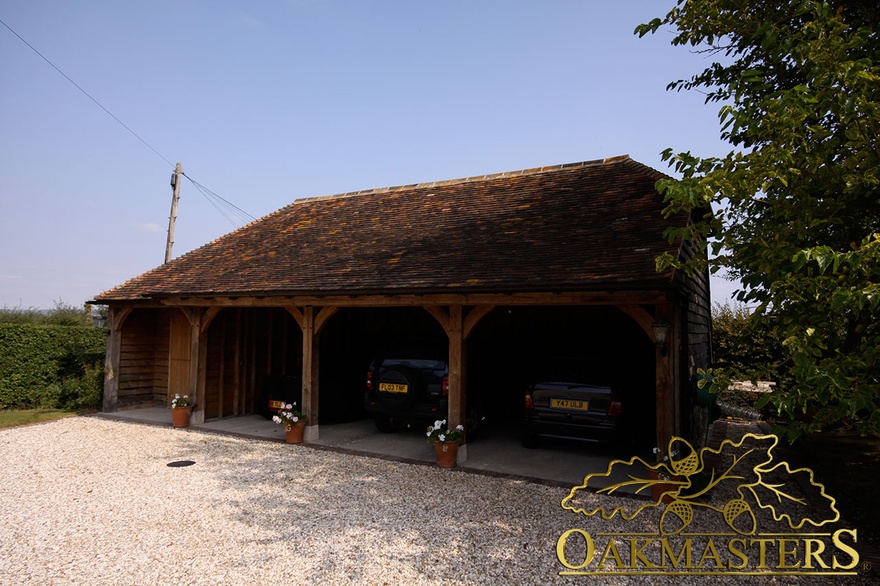 Three bay open oak garage with lockable store room