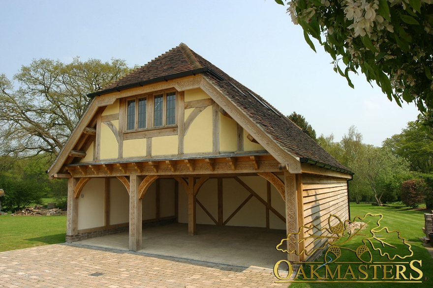 Three bay open oak framed garage with family loft room in Sussex