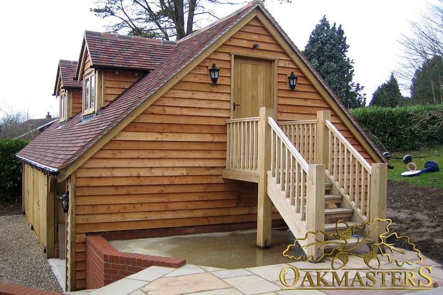Detail of external side staircase and oak utility garage door