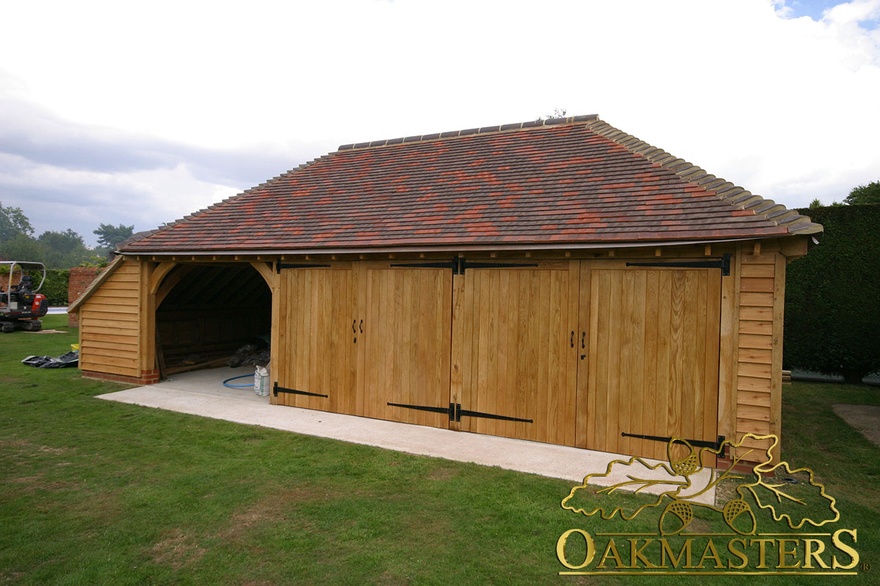 4 bay partially open garage with enclosed log store