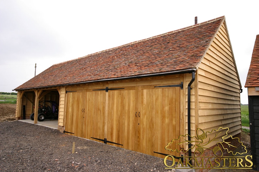 Four bay oak framed garage with two open and two closed bays