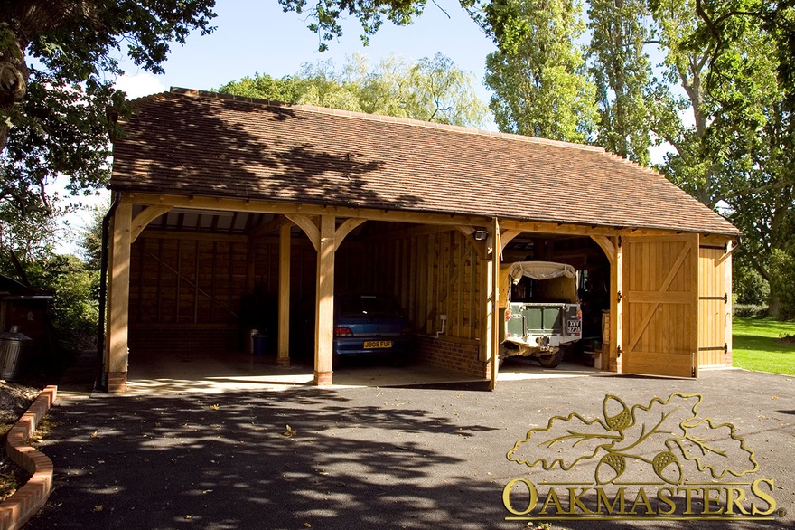Hand crafted four bay oak framed garage with tiled roof