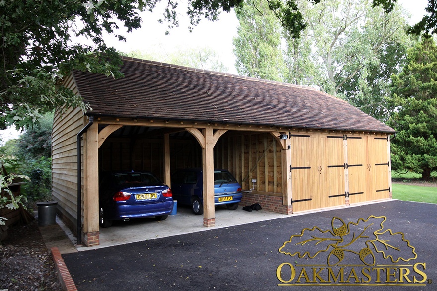 Two open and two closed oak garage bays