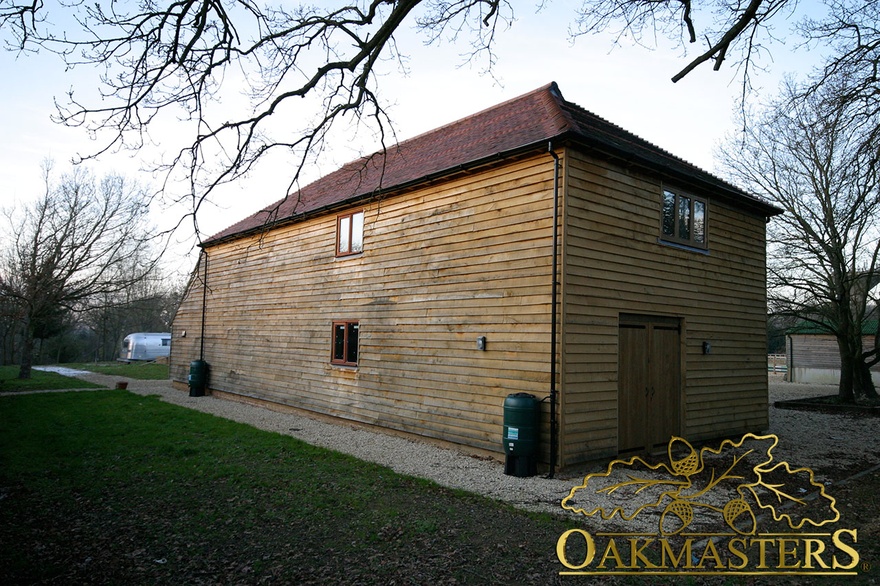 Read view of oak clad barn and stable complex
