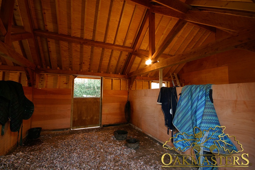 Exposed rafters inside oak stables