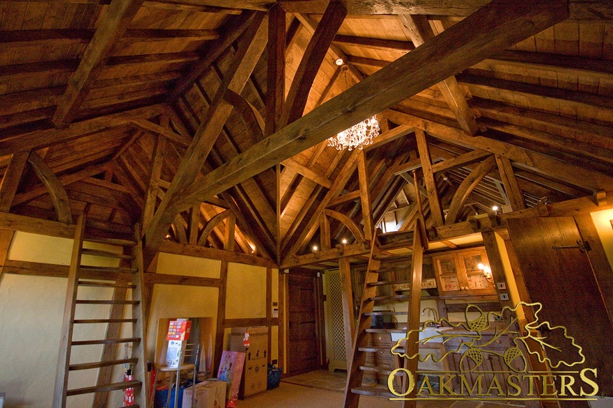 A series of exposed oak trusses and oak roof rafters