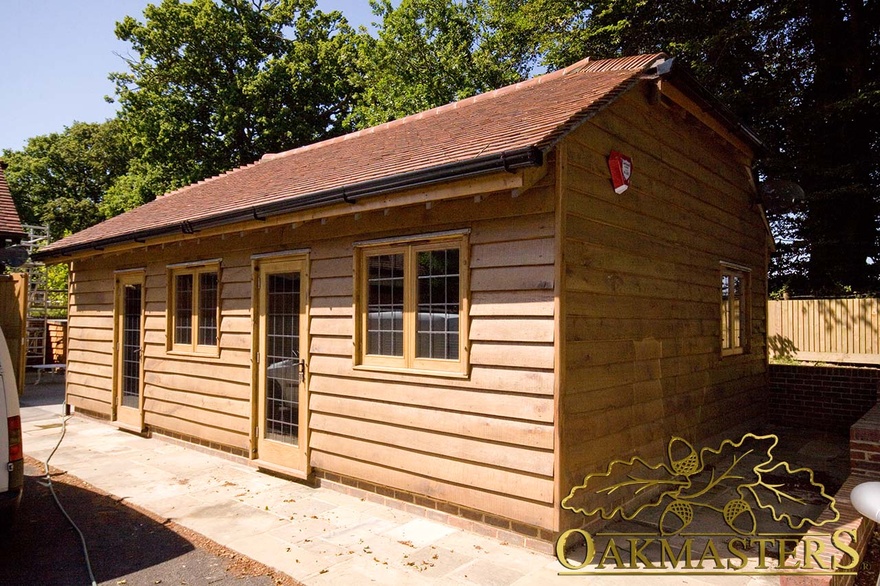 Single storey garden office with oak featheredge cladding and tiled roof