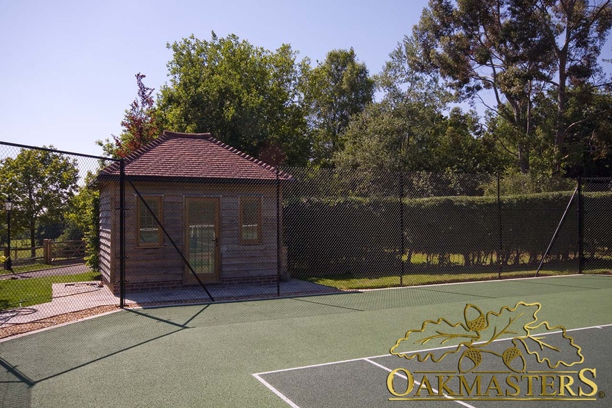 Front view of oakframe and feather edge clad tennis changing room