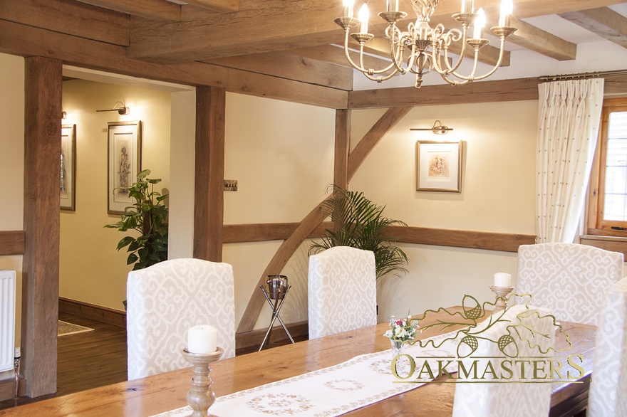 Exposed oak door frame and ceiling rafters in dining room extension