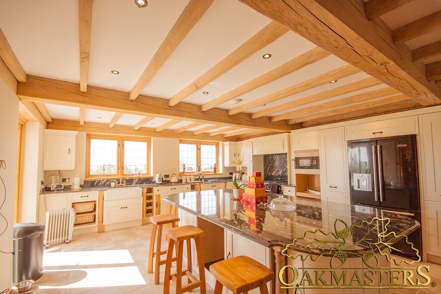 Simple straight ceiling beams in country house kitchen ceiling