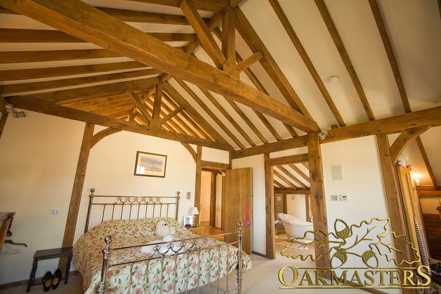 Hand crafted exposed oak frame throughout bedroom and adjoining rooms in Isle of Man residence