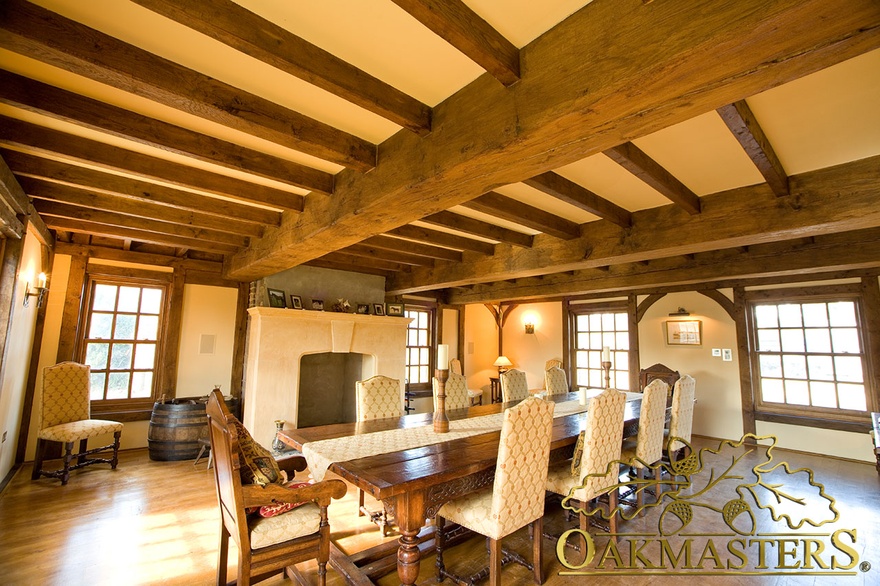 Exposed beams and oak frame windows in dining room of Isle of Man manx oak house