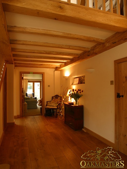 Exposed ceiling beams in country house hallway