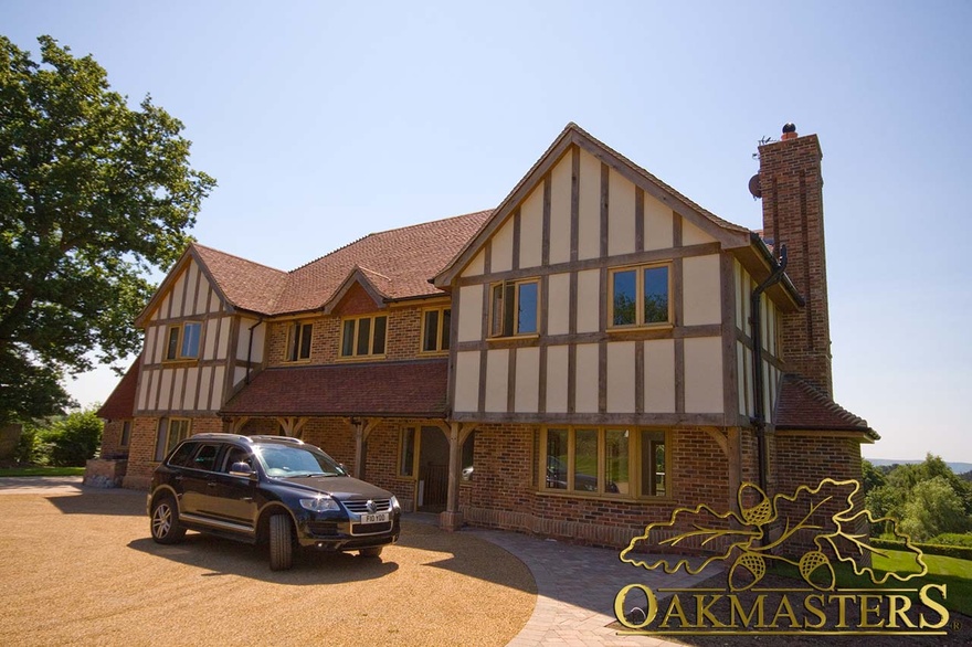 Family home with modern tudor style oak cladding