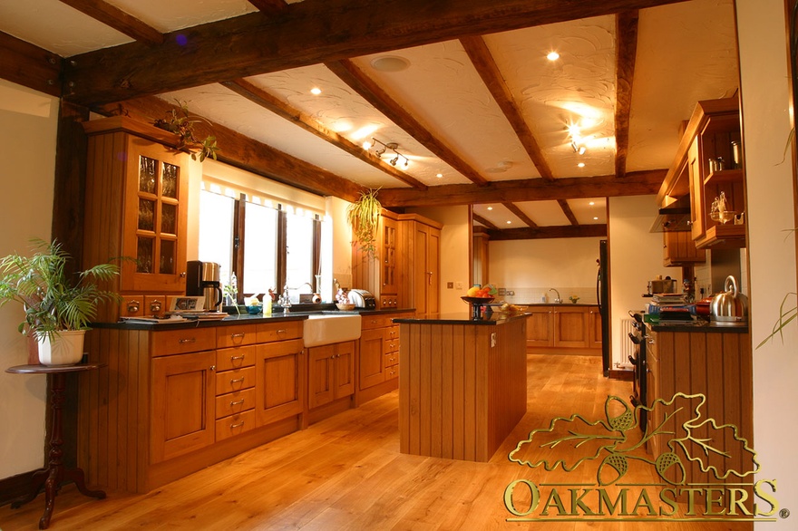 Simple straight oak beams in kitchen in oak and steel jointed house