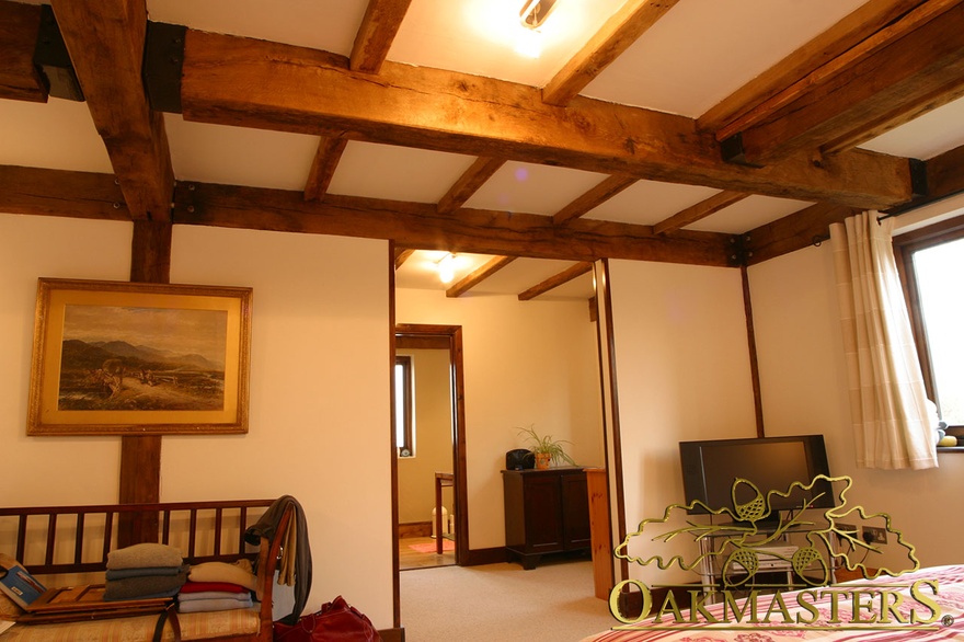Simple ceiling beams throughout oak and steel jointed house