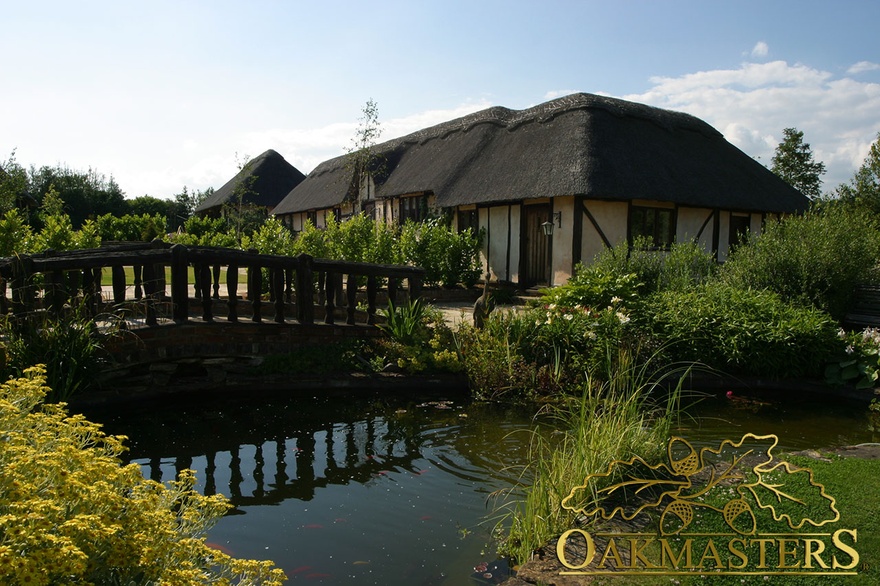 Reclaimed oak residence with thatch roof