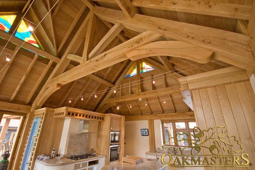 Raised tie truss above bespoke oak kitchen in single storey home