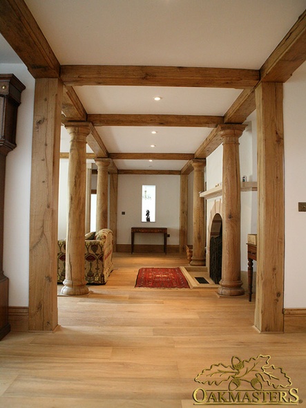 Hallway framed with hand-crafted oak columns and exposed beams