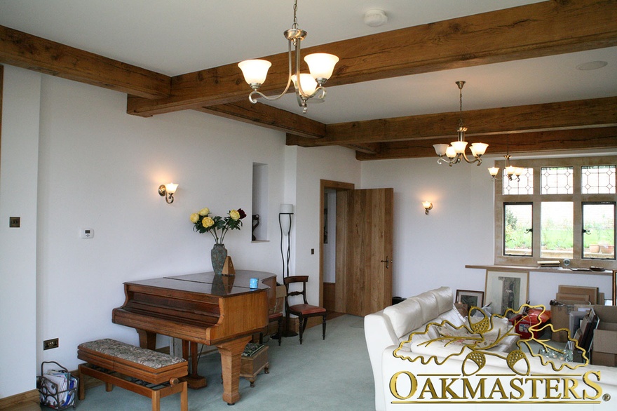 Simple straight exposed oak ceiling beams in unusual country property