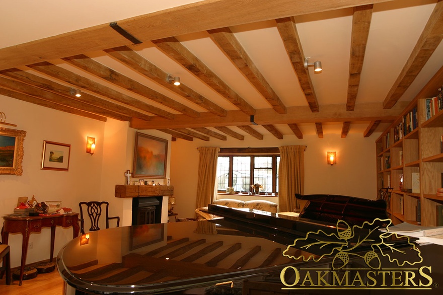 Steel main beams covered in oak beam casings support joists in this  living room - 122900