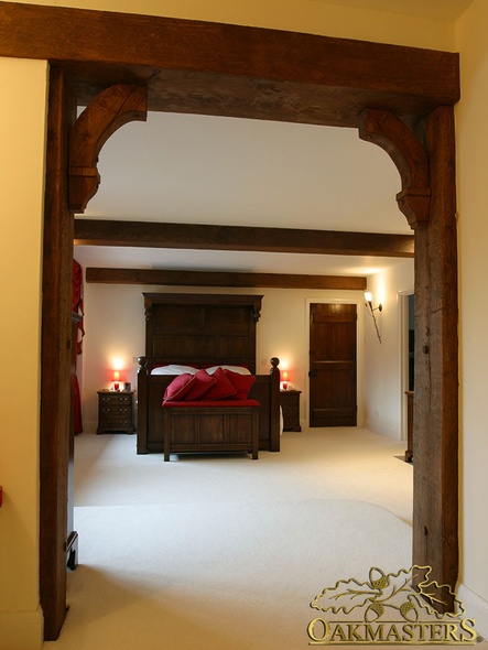 Oak beams, posts and carved brackets create a lovely doorway - 1509023
