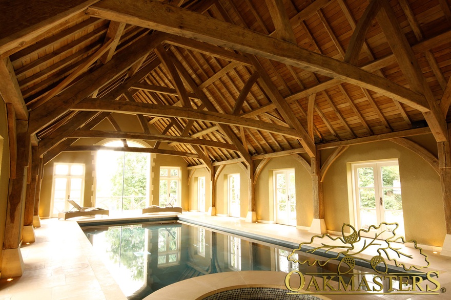 Fully exposed oak timber roof above swimming pool in large pool building