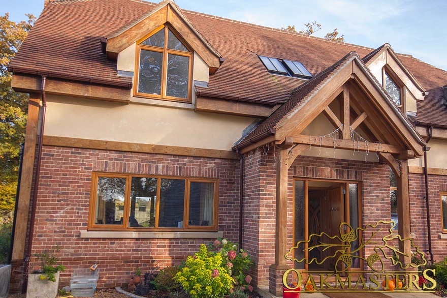 Brick and render house with oak framed porch