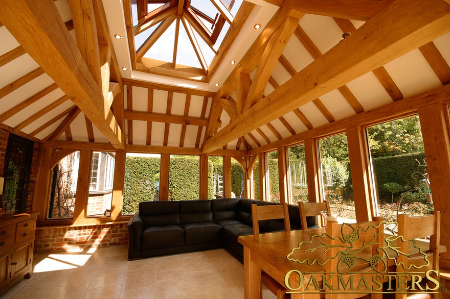 Timber truss surround glass lantern roof creating extra height and light