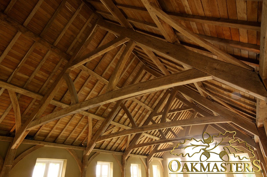 Exposed raised tie queen truss in open timber roof
