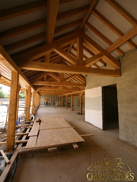 Traditional exposed truss roof under construction