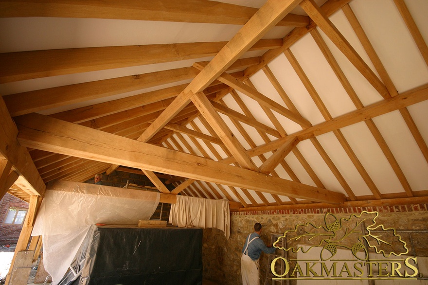 Exposed oak truss and open ceiling during build