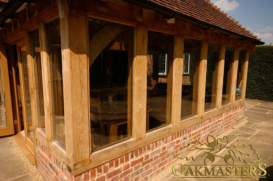 Detail of oak frame windows in orangery on listed manor house