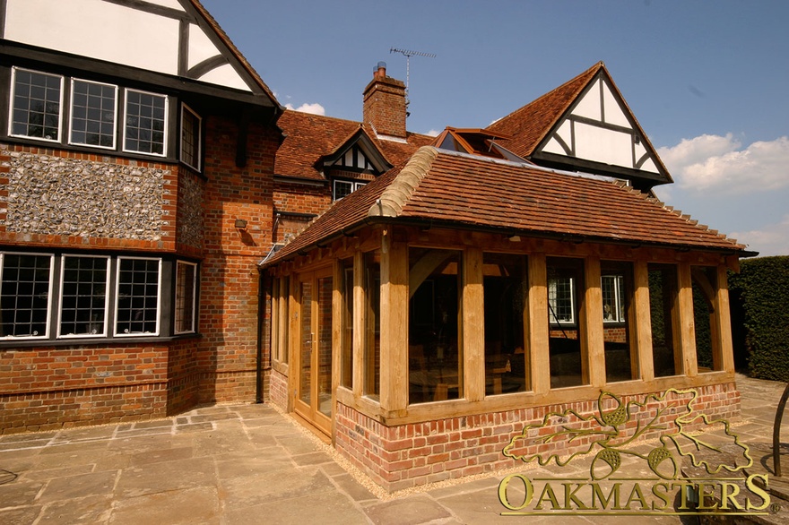 Oak frame orangery on listed brick manor house