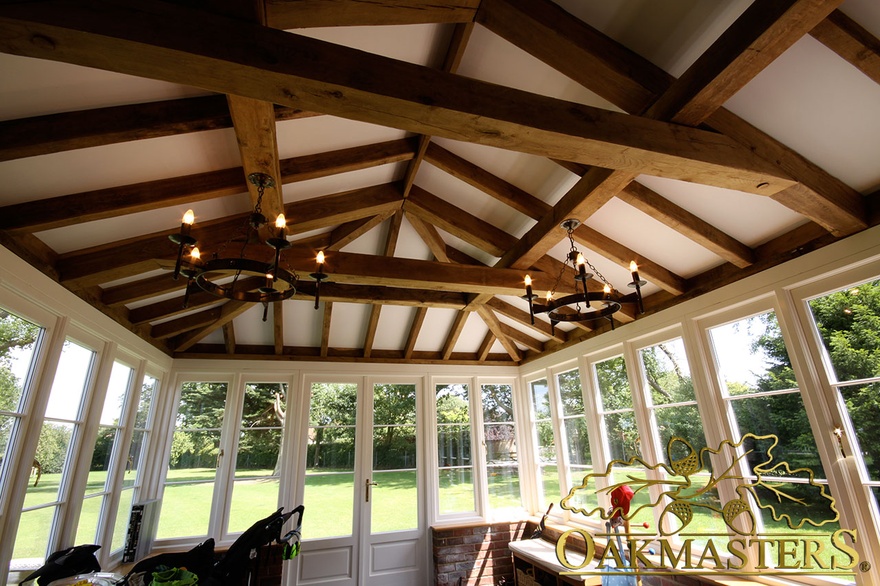Oak vaulted roof with contrasting glazed windows and doors in garden room