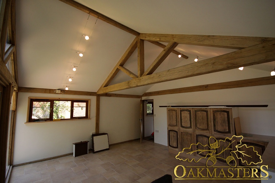 Vaulted ceiling and exposed oak truss in garden room and garage complex