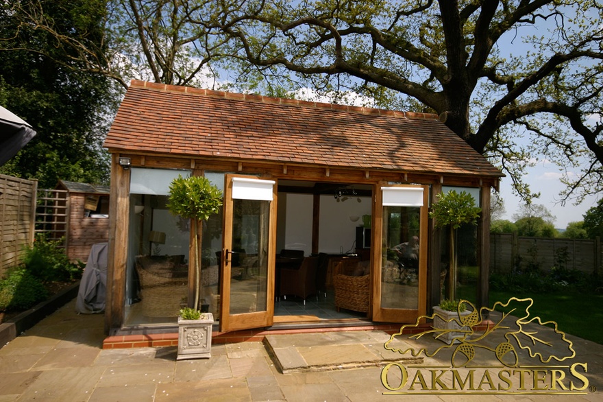 Small glazed garden room with patio doors 