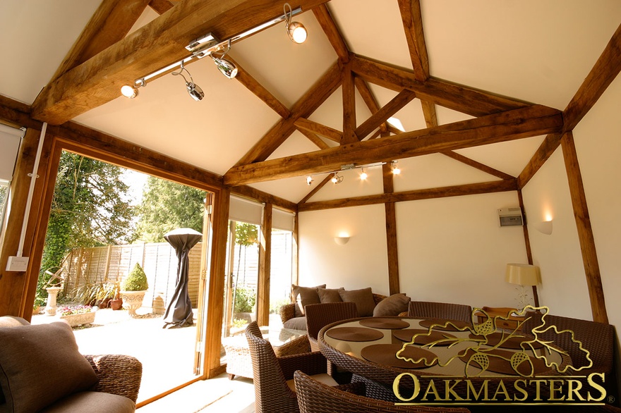 Open ceiling in small glazed garden room maximises space