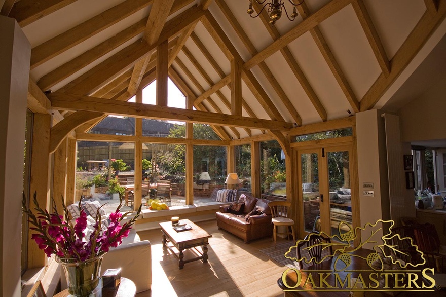 Queen post truss and vaulted ceiling to increase height and light in spectacular garden room