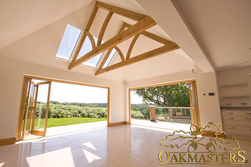 Downstairs living space features stunning floating oak trusses