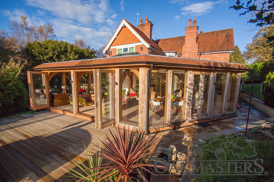 Oak framed garden room extension with encapsulated glazing system