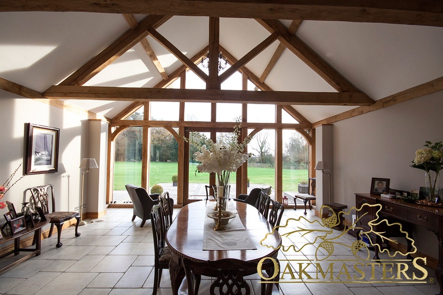 Vaulted ceiling with king post trusses make this dining room feel light and airy
