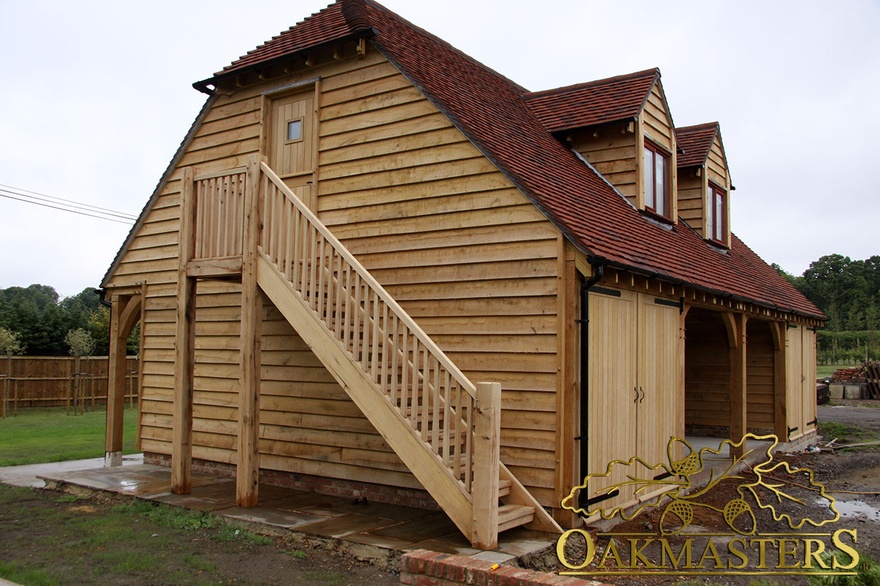 External oak staircase allows access to the loft  and maximises the space inside the oak framed garage