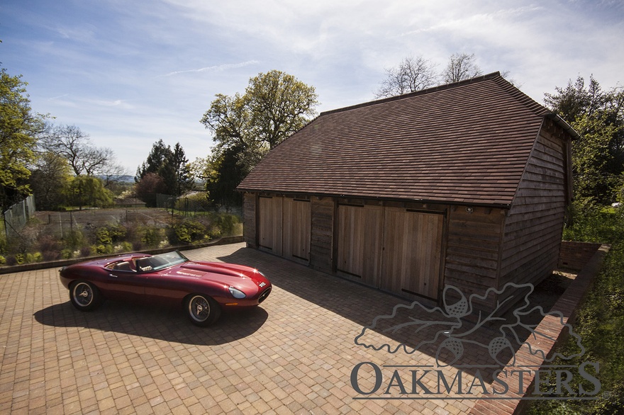 The oak garage has 2 bays plus additional storage space on each side