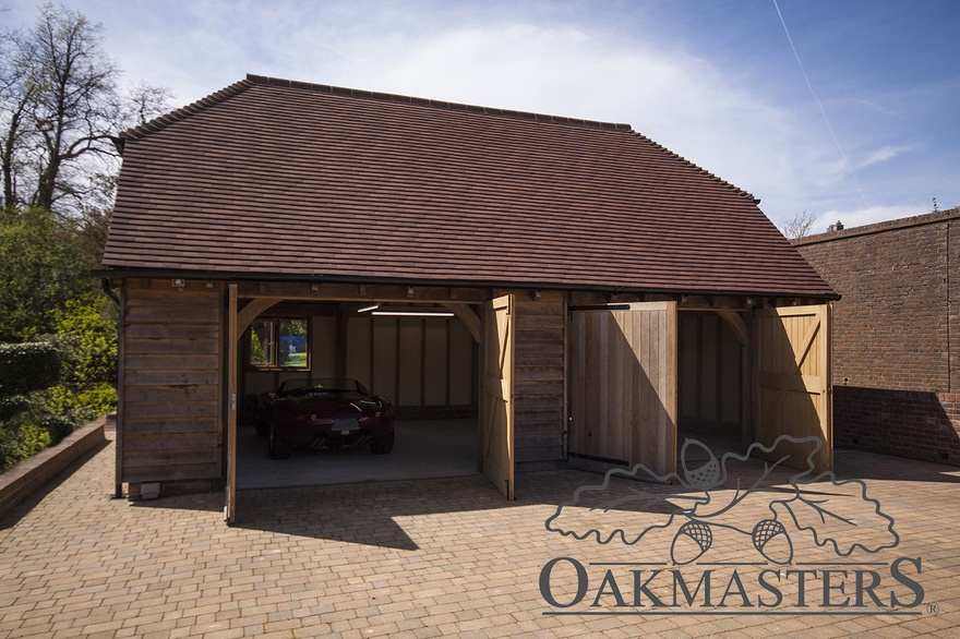 Solid oak garage doors complete the oak framed garage perfectly