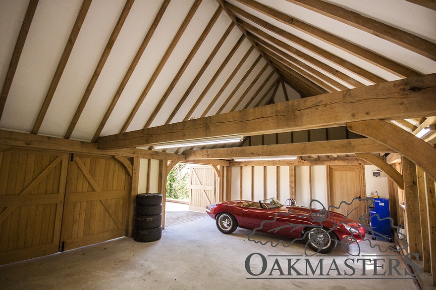 Oak rafters are exposed inside the garage roof